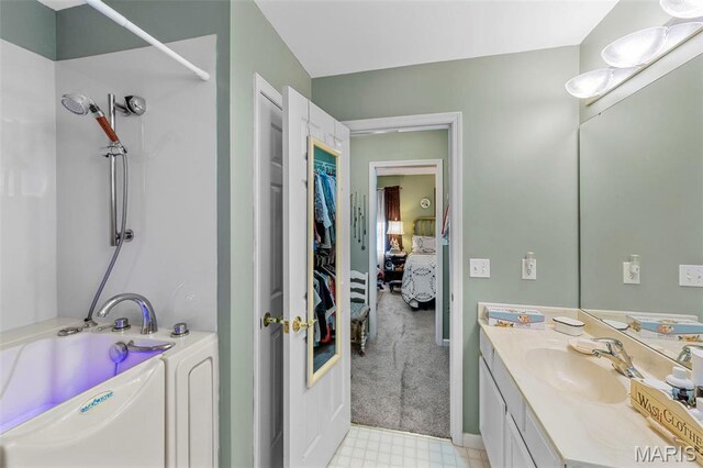 114 Fort Dodge Dr, Wright City, MO 63390 - ensuite bathroom featuring vanity, a tub to relax in, a shower, tile patterned floors, and a spacious closet