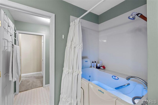 114 Fort Dodge Dr, Wright City, MO 63390 - full bathroom with a jetted tub, independent washer and dryer, curtained shower, and baseboards