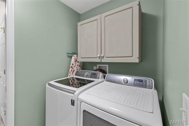 114 Fort Dodge Dr, Wright City, MO 63390 - laundry area with cabinet space and washing machine and clothes dryer