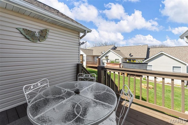 114 Fort Dodge Dr, Wright City, MO 63390 - wooden deck featuring outdoor dining space, a yard, and a residential view