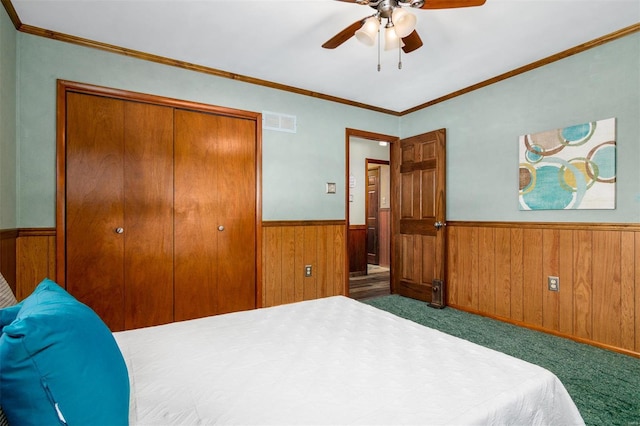 132 S Duncan St, Marine, IL 62061 - bedroom with a wainscoted wall, wooden walls, carpet, a closet, and ornamental molding