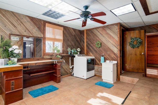 132 S Duncan St, Marine, IL 62061 - bathroom featuring wooden walls, a ceiling fan, tile patterned flooring, and a drop ceiling