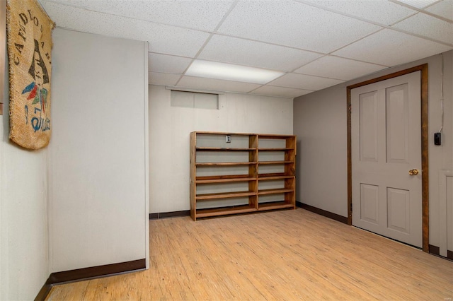 132 S Duncan St, Marine, IL 62061 - finished below grade area featuring baseboards, light wood-style flooring, and a paneled ceiling