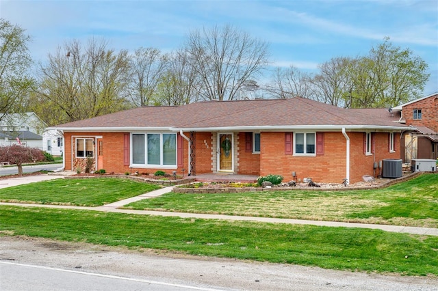132 S Duncan St, Marine, IL 62061 - ranch-style house with brick siding, a front yard, and central air condition unit