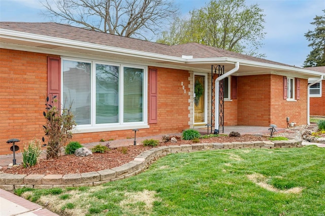 132 S Duncan St, Marine, IL 62061 - ranch-style house featuring a front yard, brick siding, and roof with shingles