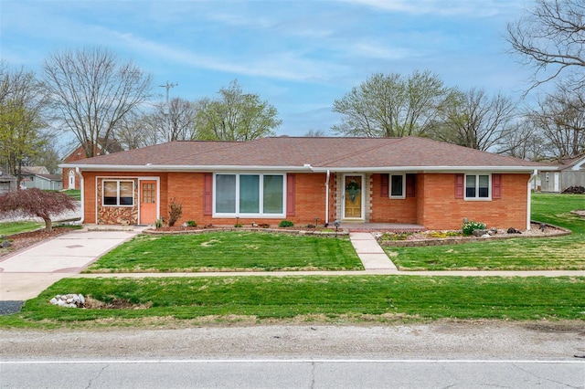 132 S Duncan St, Marine, IL 62061 - ranch-style house with brick siding, a front yard, and covered porch