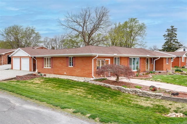 132 S Duncan St, Marine, IL 62061 - ranch-style home featuring brick siding, an attached garage, driveway, and a front yard