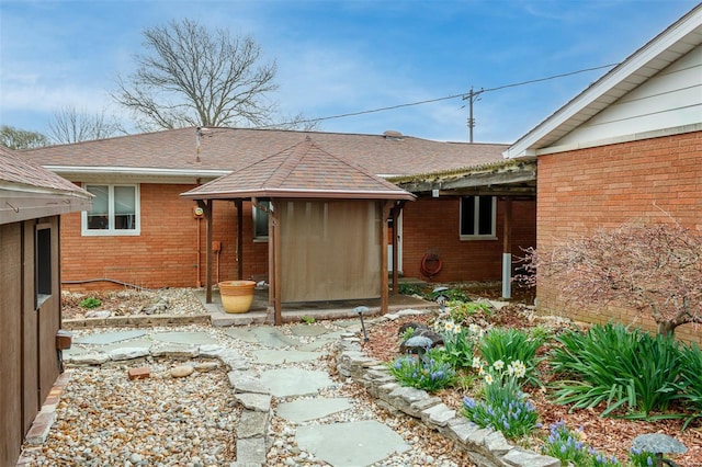 132 S Duncan St, Marine, IL 62061 - back of property with brick siding, a shingled roof, and a gazebo