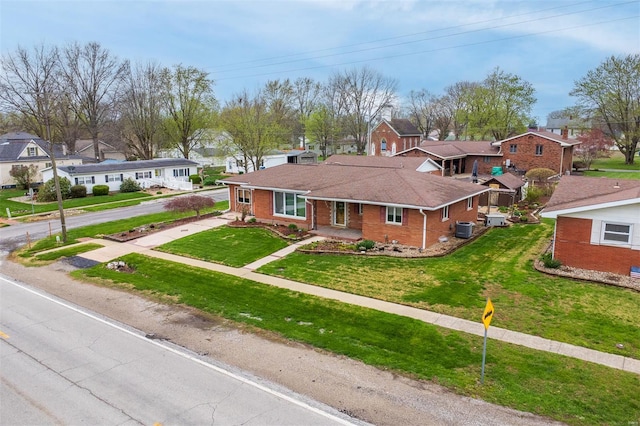 132 S Duncan St, Marine, IL 62061 - ranch-style house featuring a residential view, central AC unit, brick siding, driveway, and a front yard