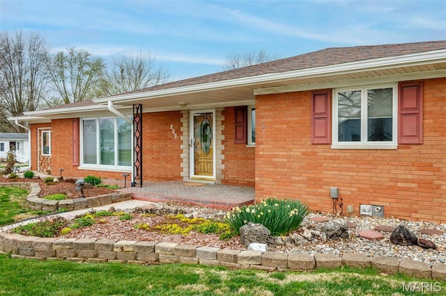 132 S Duncan St, Marine, IL 62061 - single story home with brick siding, a porch, and a shingled roof