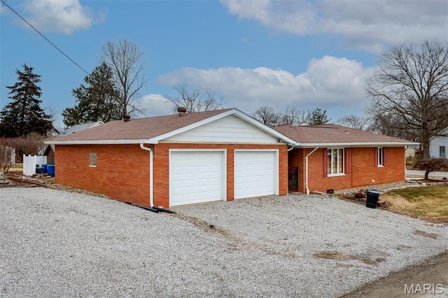 132 S Duncan St, Marine, IL 62061 - view of front of house with brick siding, an attached garage, driveway, and roof with shingles