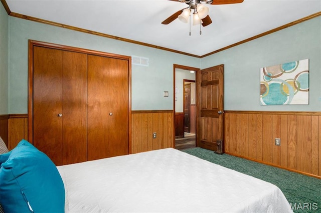 132 S Duncan St, Marine, IL 62061 - bedroom with a wainscoted wall, wooden walls, carpet, a closet, and crown molding