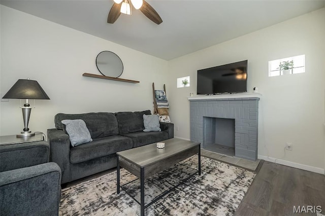 409 Jett Ave, Saint Louis, MO 63125 - living area with ceiling fan, wood finished floors, a fireplace, and baseboards