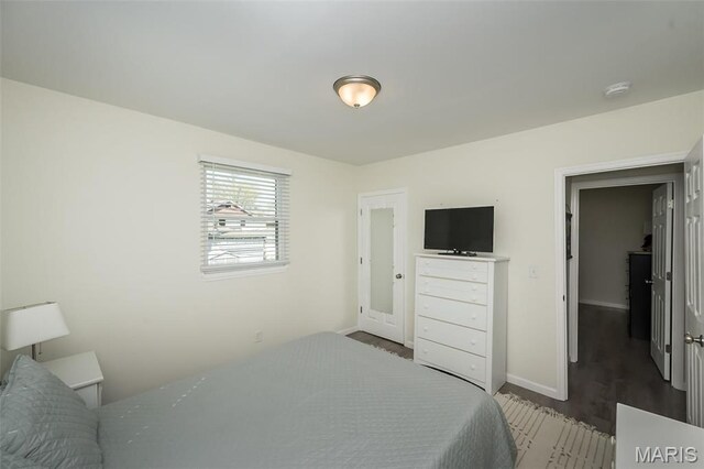 409 Jett Ave, Saint Louis, MO 63125 - bedroom with baseboards and wood finished floors