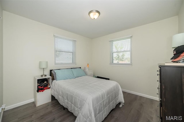 409 Jett Ave, Saint Louis, MO 63125 - bedroom with baseboards and dark wood-style flooring
