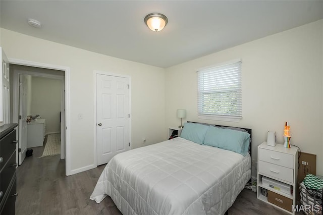 409 Jett Ave, Saint Louis, MO 63125 - bedroom featuring dark wood finished floors and baseboards