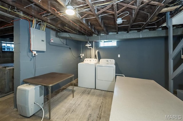 409 Jett Ave, Saint Louis, MO 63125 - clothes washing area with washing machine and clothes dryer, electric panel, and wood finished floors