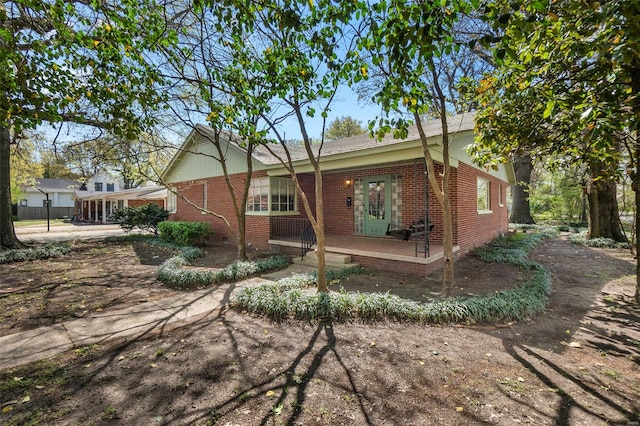 605 W Washington St, Kennett, MO 63857 - view of home's exterior with brick siding and crawl space