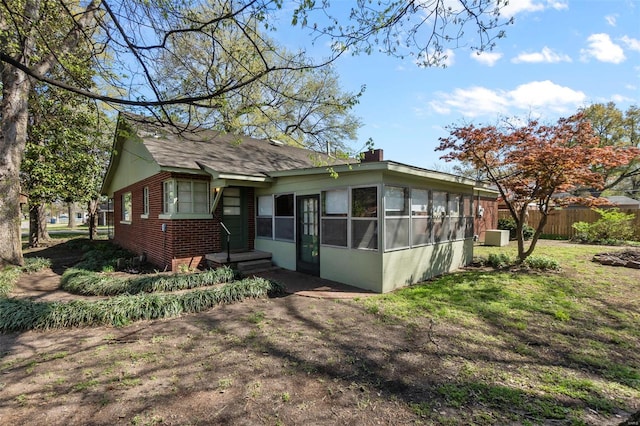 605 W Washington St, Kennett, MO 63857 - rear view of property featuring brick siding and fence