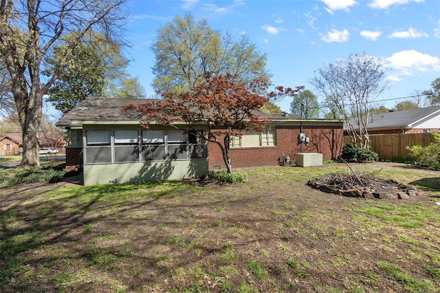 605 W Washington St, Kennett, MO 63857 - rear view of house featuring brick siding