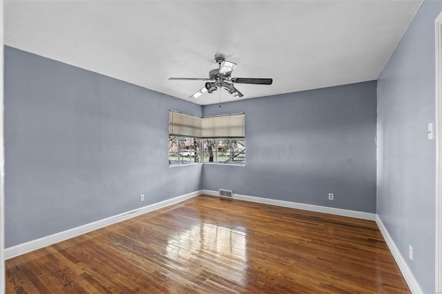 605 W Washington St, Kennett, MO 63857 - unfurnished room with a ceiling fan, wood finished floors, and baseboards