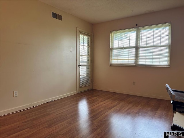 8736 Santa Bella Dr Unit G, Hazelwood, MO 63042 - spare room featuring wood finished floors and baseboards