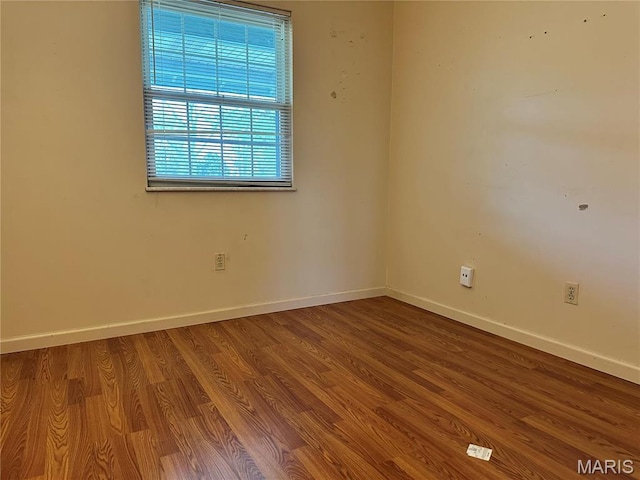 8736 Santa Bella Dr Unit G, Hazelwood, MO 63042 - spare room featuring baseboards and wood finished floors