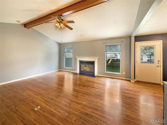 1 Pine Forest Ct, Dardenne Prairie, MO 63368 - unfurnished living room with a ceiling fan, plenty of natural light, wood finished floors, and a fireplace with flush hearth