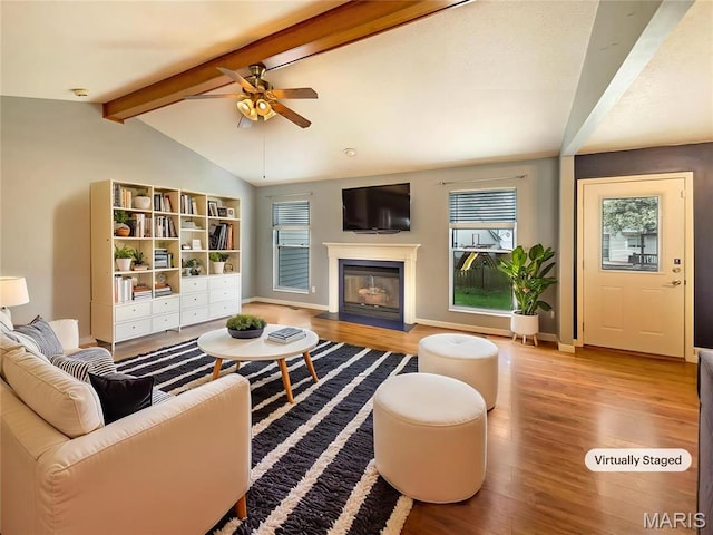 1 Pine Forest Ct, Dardenne Prairie, MO 63368 - living area with wood finished floors, a ceiling fan, plenty of natural light, and a glass covered fireplace