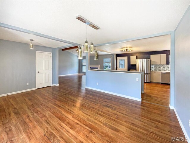 1 Pine Forest Ct, Dardenne Prairie, MO 63368 - kitchen with appliances with stainless steel finishes, wood finished floors, open floor plan, decorative light fixtures, and a chandelier
