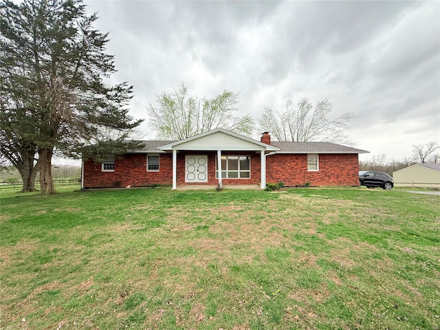 2737 Brune Rd, Farmington, MO 63640 - single story home featuring a chimney, a front lawn, and brick siding