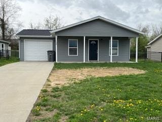 134 Southview Dr, Jackson, MO 63755 - ranch-style house featuring a garage, concrete driveway, and a porch