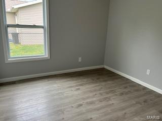 134 Southview Dr, Jackson, MO 63755 - spare room featuring baseboards and wood finished floors