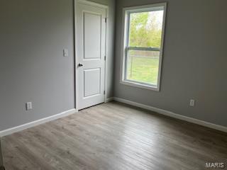 134 Southview Dr, Jackson, MO 63755 - empty room with baseboards and wood finished floors