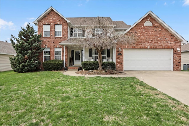 10 Addison St, Collinsville, IL 62234 - traditional-style home featuring brick siding, a porch, concrete driveway, and a front yard