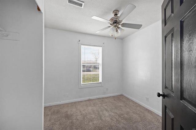 47 E Adams Dr E, St Louis, IL 62206 - carpeted spare room featuring a textured ceiling, baseboards, and ceiling fan