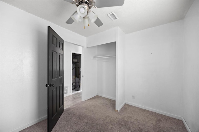 47 E Adams Dr E, St Louis, IL 62206 - unfurnished bedroom featuring light carpet, a closet, baseboards, and ceiling fan