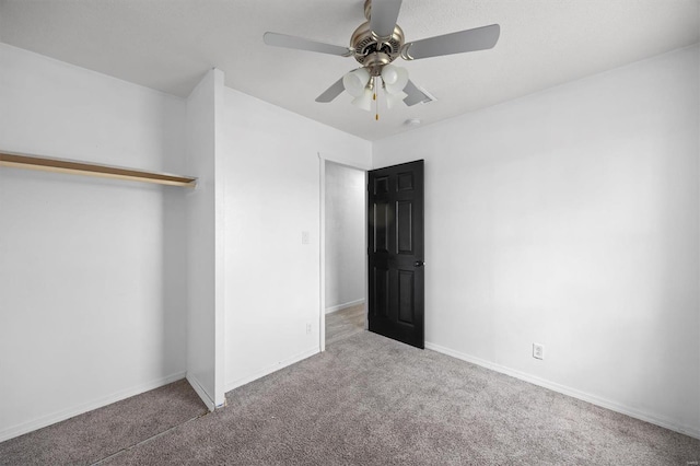 47 E Adams Dr E, St Louis, IL 62206 - unfurnished bedroom featuring carpet floors, baseboards, a ceiling fan, and a closet