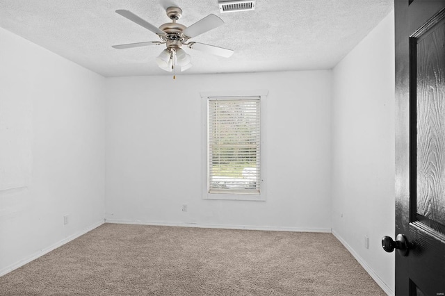 47 E Adams Dr E, St Louis, IL 62206 - spare room with carpet flooring, a textured ceiling, ceiling fan, and baseboards