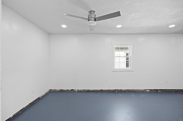47 E Adams Dr E, St Louis, IL 62206 - spare room featuring recessed lighting, ceiling fan, a textured ceiling, and concrete floors