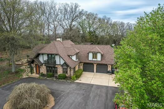 762 Crider Ln, Union, MO 63084 - view of front of home featuring asphalt driveway and a balcony