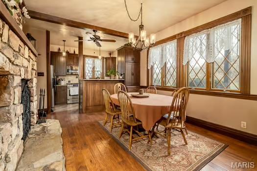 762 Crider Ln, Union, MO 63084 - dining space with plenty of natural light, dark wood finished floors, ceiling fan, a chandelier, and beamed ceiling