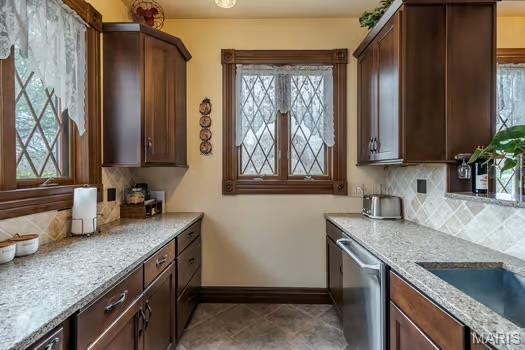 762 Crider Ln, Union, MO 63084 - kitchen featuring dishwasher, baseboards, and tasteful backsplash