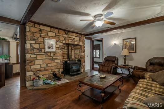 762 Crider Ln, Union, MO 63084 - living area with ceiling fan, beam ceiling, a wood stove, and wood finished floors
