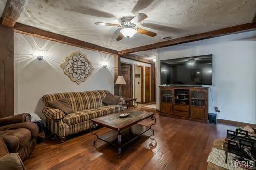 762 Crider Ln, Union, MO 63084 - living room featuring a ceiling fan, wood finished floors, and beam ceiling