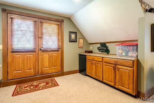762 Crider Ln, Union, MO 63084 - kitchen with light countertops, lofted ceiling, brown cabinets, baseboards, and light colored carpet