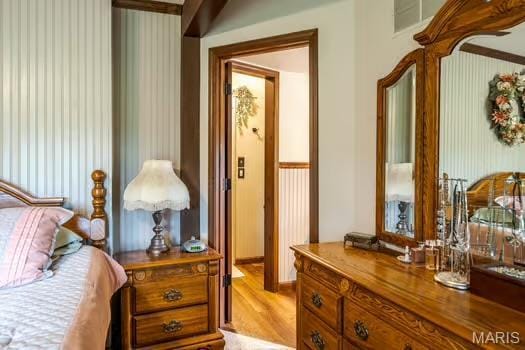 762 Crider Ln, Union, MO 63084 - bedroom with wallpapered walls and light wood finished floors