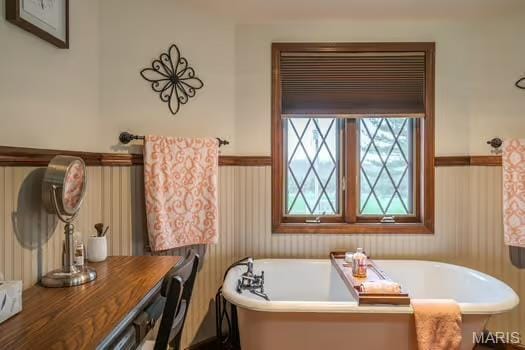762 Crider Ln, Union, MO 63084 - bathroom with wainscoting and a freestanding bath