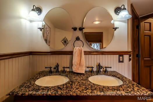 762 Crider Ln, Union, MO 63084 - bathroom featuring a wainscoted wall and double vanity