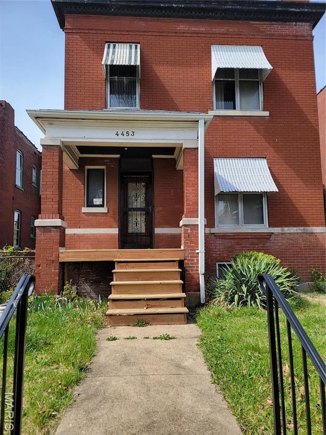 4453 Athlone Ave, Saint Louis, MO 63115 - view of front of home with brick siding and a porch